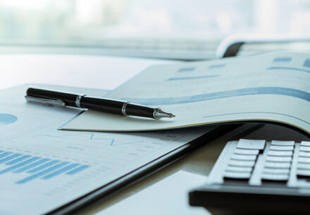 business reports and a calculator.