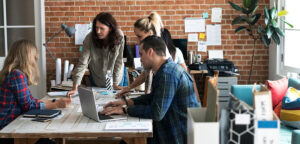 a group of people having a meeting.