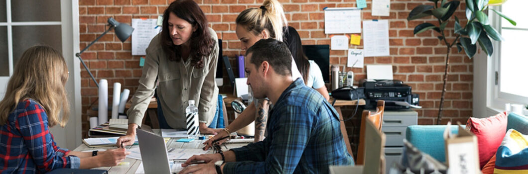 a group of people having a meeting.