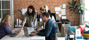 a group of people having a meeting.
