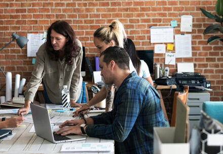 a group of people having a meeting.