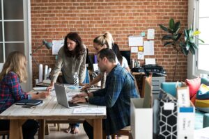 a group of people having a meeting.