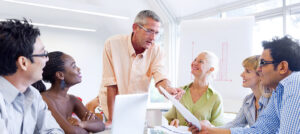 a group of people receiving financial mentoring.