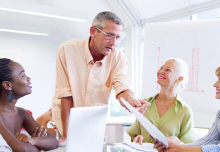 a group of people receiving financial mentoring.