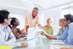 a group of people receiving financial mentoring.