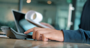 a person paying bills at work.