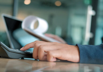 a person paying bills at work.