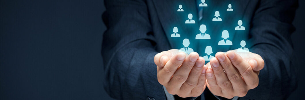 Protecting gesture of businessman or personnel and icons representing group of people.