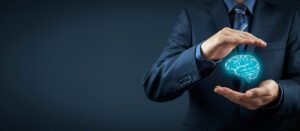 concept art of a businessman holding a virtual brain between his hands.