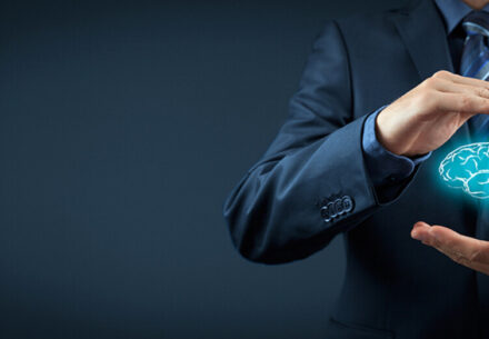 concept art of a businessman holding a virtual brain between his hands.