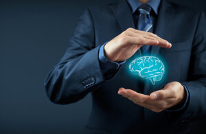 concept art of a businessman holding a virtual brain between his hands.