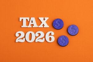 the words tax 2026 over an orange background.