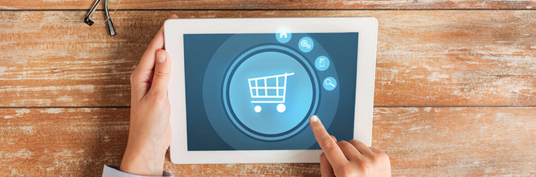 a person points to a general online retail symbol on a tablet computer.