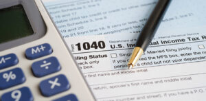 a Form 1040 and a calculator.