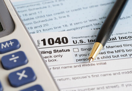 a Form 1040 and a calculator.