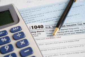 a Form 1040 and a calculator.