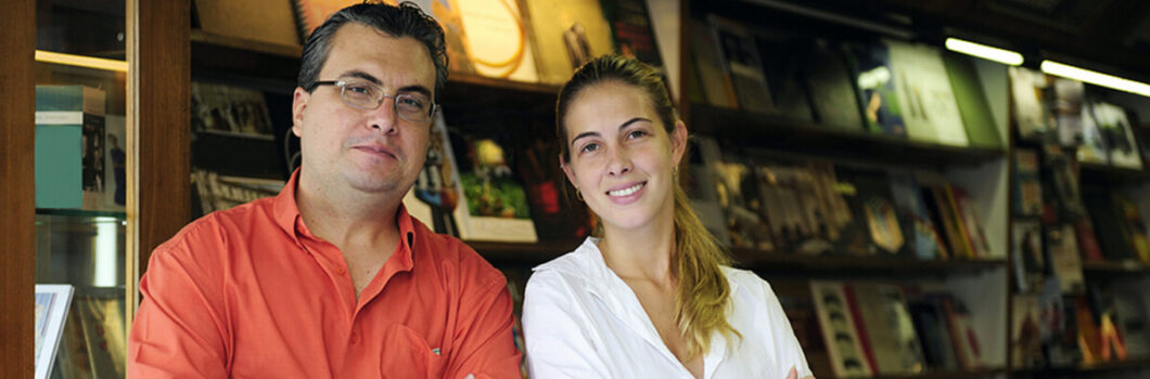 a father and daughter working at a bookstore.