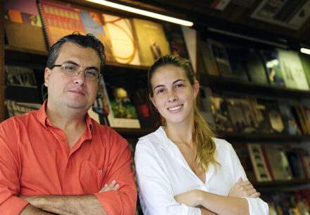 a father and daughter working at a bookstore.