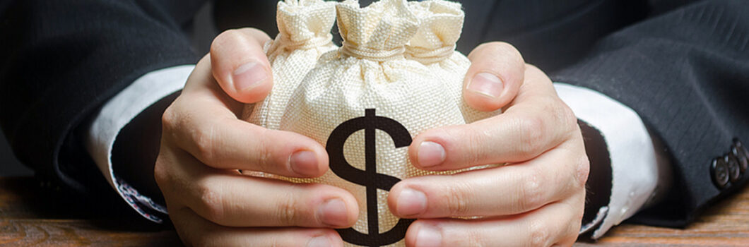 a lender handing over a couple small bags of money.