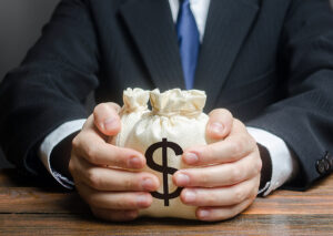 a lender handing over a couple small bags of money.