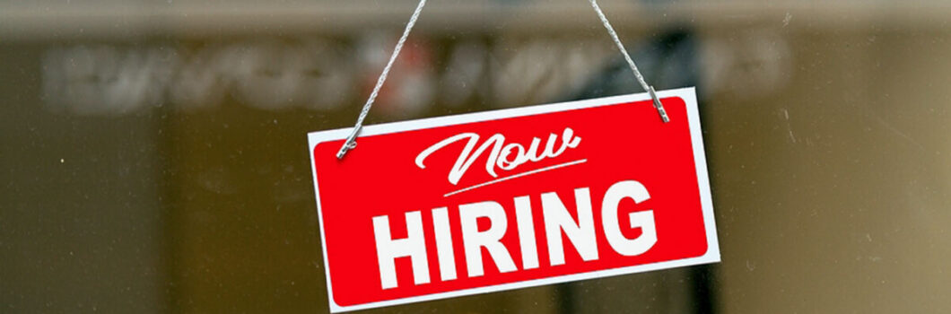 A now hiring sign.