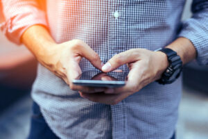 a man uses a smartphone.