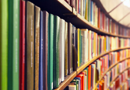 curving library shelves full of books.
